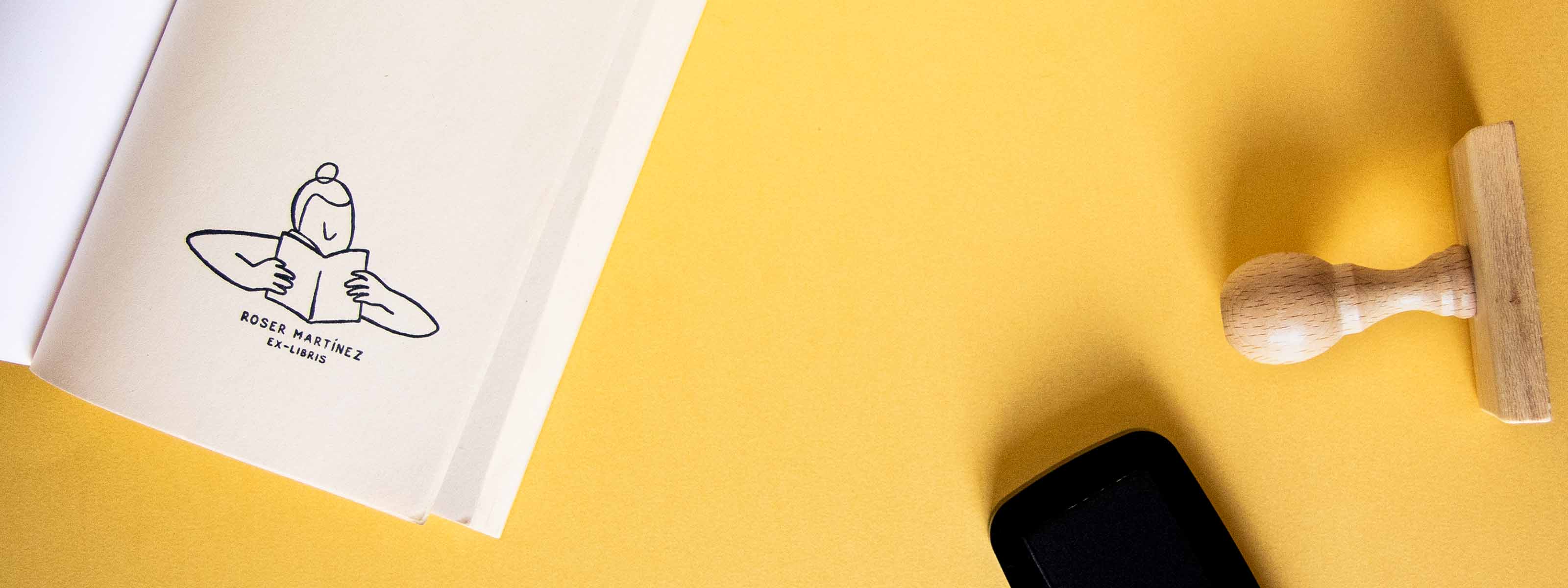 Personalized bookplate stamped on an open book's front page